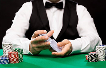 Live Casino Dealer Holding Cards