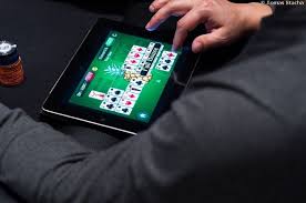 Arcade Games - Man Playing Card Game on Tablet